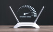 © andranik123 - Modern wifi router with a speedometer. Internet speed