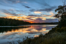 Spectacle Pond Near Moosehead Lake, Maine, At Sunset With Beautiful Cloudscape Colors