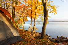 Waterside Campsite In Autumn With Beautiful Fall Colors
