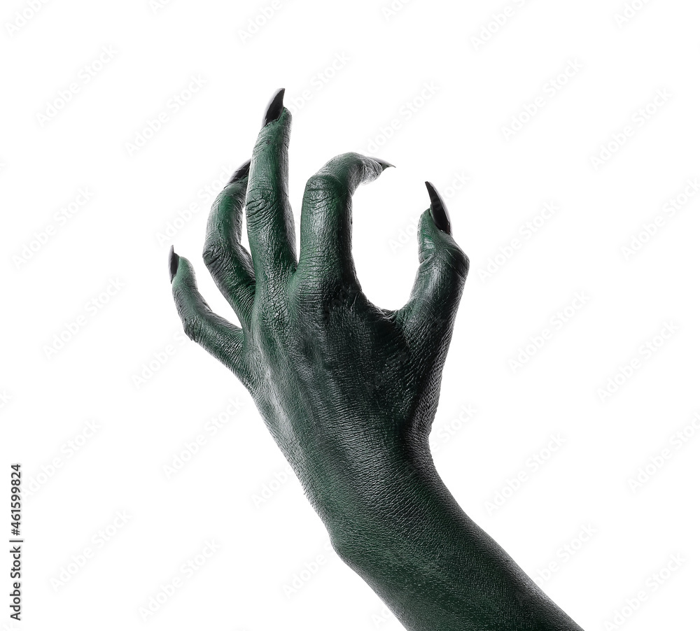 Halloween green witch's or zombie's hand isolated on white