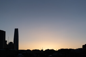 Wall Mural - silhouette of city buildings at sunset in the city