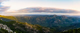 Fototapeta Na ścianę - View from above, stunning landscape with a mountain range and a valley during a beautiful sunrise. Panoramic view from Monte Pino, (Vedetta Monte Pino) Sardinia, Italy.