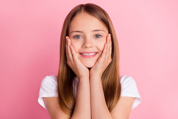 Wall Mural - Photo of cute blond small girl hands face wear white t-shirt isolated on pink color background