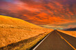 Mesmerizing view of empty asphalt road during a breathtaking sunset