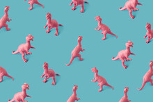Creative Isometric Pink Painted Dinosaur Toy Pattern On Blue Background.  Minimal Abstract Concept For School And Kids.