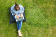 Woman working as a freelancer on laptop in summer in the garden