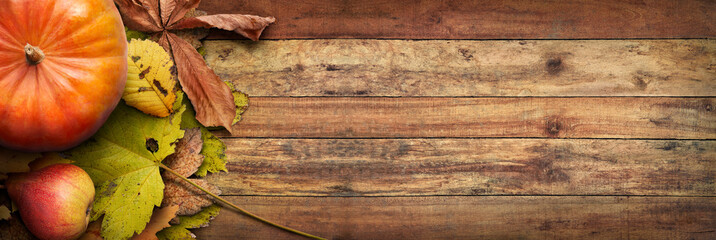 Sticker - a thanksgiving autumn harvest background of pumpkins, pears and leaves on a rustic wooden table with