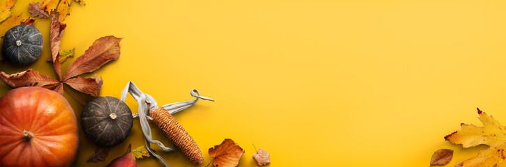 Poster - a thanksgiving autumn harvest background of pumpkins, pears, leaves and corncobs isolated against a 
