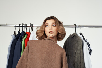 pretty woman in red dress Shopaholic choosing clothes shopping in store isolated background