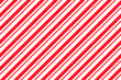 Candy cane seamless pattern. Christmas striped red background. Cute caramel package print. Xmas holiday diagonal lines. Peppermint wrapping texture. Abstract geometric wallpaper. Vector illustration.