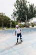© ADDICTIVE STOCK - Young person with skateboard in skate park