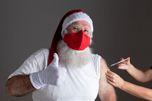 Santa Claus Wearing Face Mask Getting Vaccinated With Injection