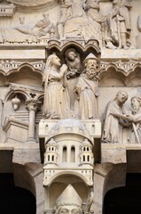 Wall Mural - Paris, France - famous Notre Dame cathedral facade saint statues. UNESCO World Heritage Site