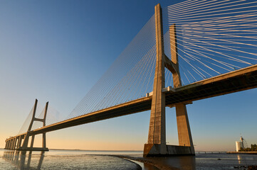 Long exposure shot of Vasco da Gama bridge in Lisbon at sunrise