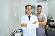 © Kostiantyn - Two male dentists smiling and looking professional