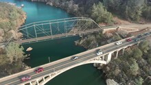 Aerial: Folsom And Rainbow Bridge Crossing Lake Natoma, California, USA