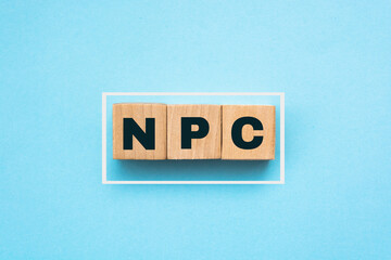 Wall Mural - Wood cubes with acronym 'NPS' - 'net promoter score' on a beautiful blue background. Business concept, copy space.