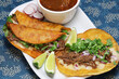 birria tacos with broth for dipping, mexican food
