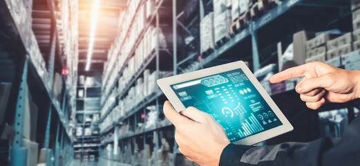 Warehouse management innovative software in computer for real time monitoring of goods package delivery . Computer screen showing smart inventory dashboard for storage and supply chain distribution .