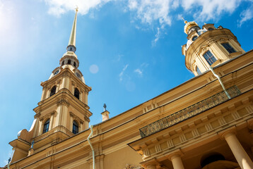 Wall Mural - The spire of the Peter and Paul Cathedral against the background of the blue sky.