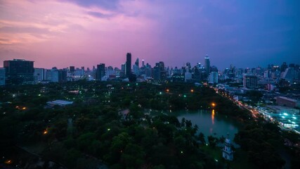 Wall Mural - Day and night transition time lapse of cityscape and buildings in metropolis . Downtown city center business district in panoramic view .