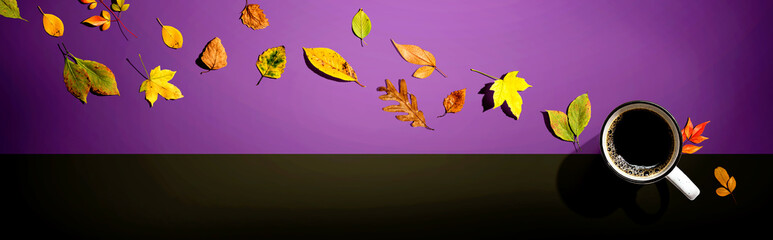 Wall Mural - Autumn leaves with a cup of coffee from above