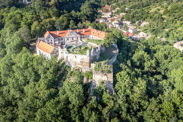 Wall Mural - Aerial panoramic view of Gothic hilltop ruined castle Kekko, Modry Kamen or Blue Stone, in Southern Slovakia above a village