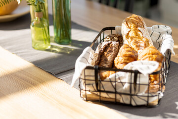 Aufkleber - Basket with various baked goods on the kitchen home table