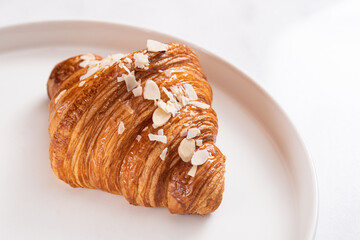 Wall Mural - French fresh croissant with almond shavings