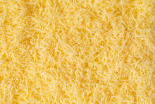 Grated Cheese Background Texture. Yellow Shredded  Cheese. Close Up Top View.
