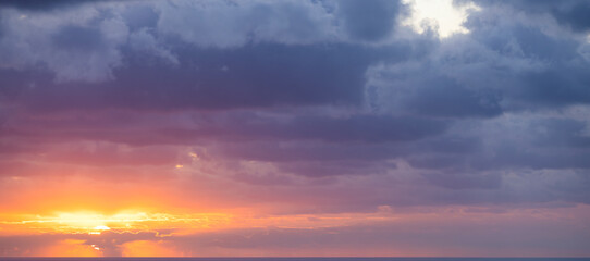 Wall Mural - Natural background, stunning view of a dramatic, cloudy sunrise. Romantic sky, copy space, sky replacement, Sardinia, Italy.