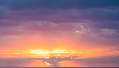 Wall Mural - Natural background, stunning view of a dramatic, cloudy sunrise. Romantic sky, copy space, sky replacement, Sardinia, Italy.