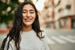 © Krakenimages.com - Young middle east girl smiling happy standing at the city.
