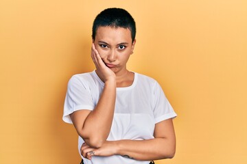 Sticker - Beautiful hispanic woman with short hair wearing casual white t shirt thinking looking tired and bored with depression problems with crossed arms.