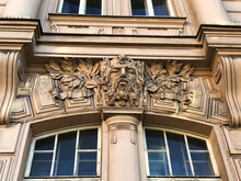 Art Nouveau Building Facade Featuring Old Man Nature