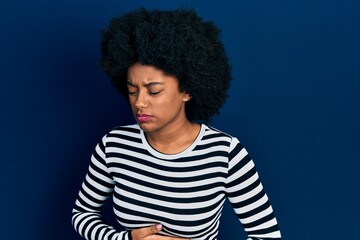 Sticker - Young african american woman wearing casual clothes with hand on stomach because indigestion, painful illness feeling unwell. ache concept.