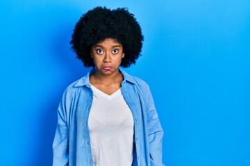 Canvas Print - Young african american woman wearing casual clothes depressed and worry for distress, crying angry and afraid. sad expression.