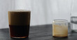 espresso tonic pour tonic in espresso on black wood table