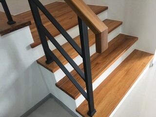 wood stair with black steel railing 