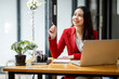 © David - Shot of an Asian young business Female working on laptop computer in her workstation.Portrait of Business people employee freelance online marketing e-commerce telemarketing concept.