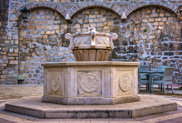 Canvas Print - Fountain near church