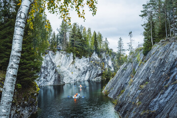 Wall Mural - Pleasure boat in Marble canyon in the mountain park of Ruskeala, Karelia, Russia