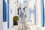 Fototapeta Na drzwi - Famous old town narrow street with white houses. Mykonos island, Greece