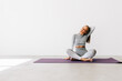 © F8  \ Suport Ukraine - Young female stretching neck while practicing yoga during workout