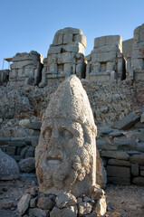 Herakles Statue behind Stone Thrones at Mount Nemrut in Adiyaman, Turkey. Mount Nemrut in southeastern Turkey and royal tombs is from the 1st century BC.