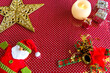 © Giovani Dressler - Christmas figures and Christmas decoration on red background.