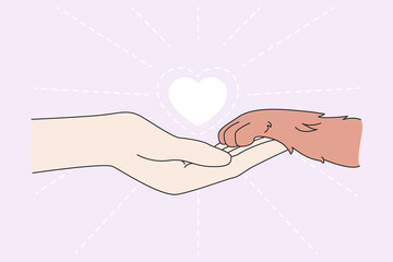 Human hand hold dog paw show care and love for animals. Person and pet friendship. People caring about puppies and cats. Flat vector illustration. Adoption and shelter, charity, volunteer concept. 