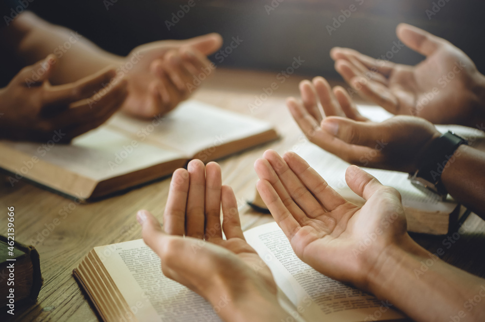 Christian group of people holding hands praying worship to believe and ...