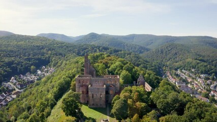 Wall Mural - Cinematic overflight of a monastery ruin in Bad Dürkheim on a sunny day. Aerial view 4k Germany