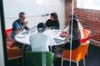 © Jacob Lund - Businesspeople having a discussion in a meeting room
